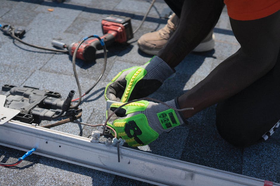 Professional solar installer working on a residential roof